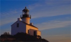 Light house in front of cirrus clouds